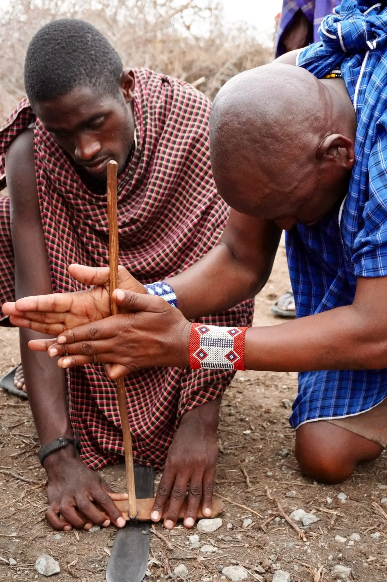 Maasai villagers making fire