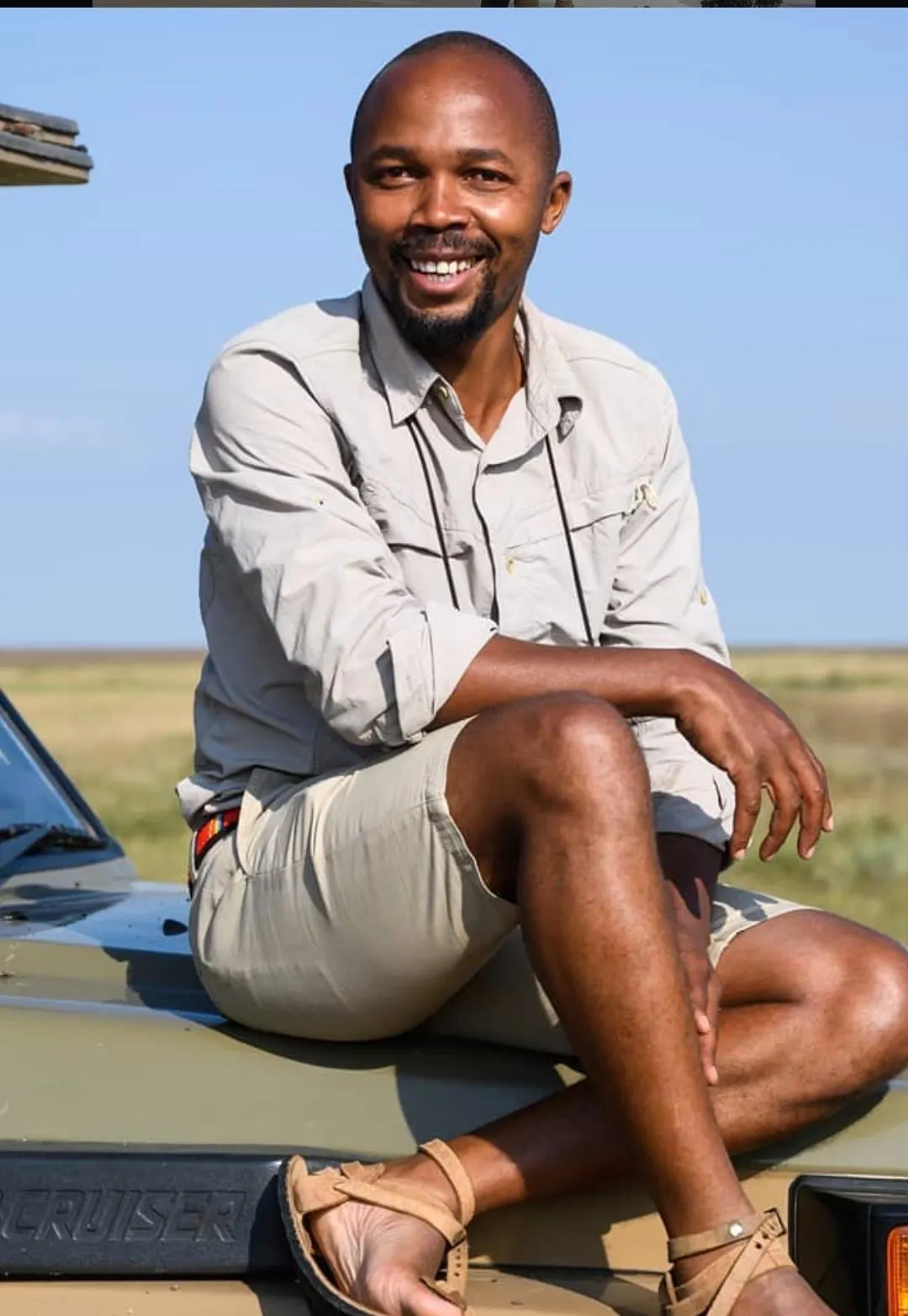 Raphiele Mpille, safari guide at Kingse Safaris, on a Land Cruiser in northern Tanzania